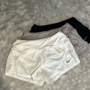 Women’s Nike Dri Fit 2” shorts. Lot of 3. Size Small. White, Grey and Black.
